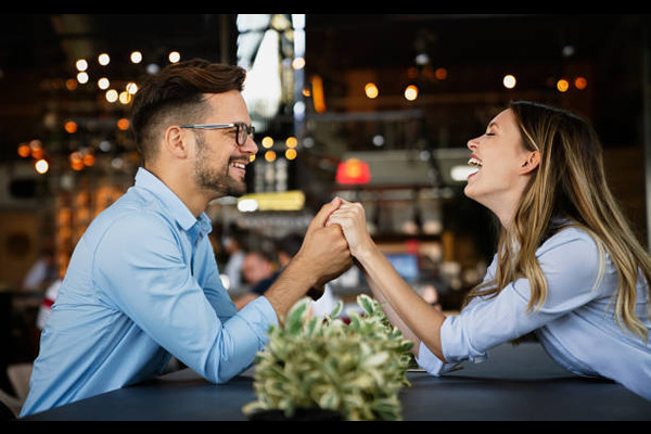 Romantic couple in cafe having date and enjoying being together stock photo