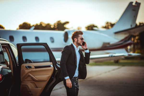 Young rich businessman talking on a mobile phone stock photo